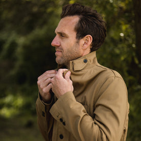 The fit model adjusting his collar