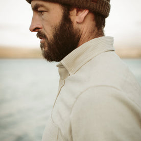 The fit model wearing the natural corded jack next to water