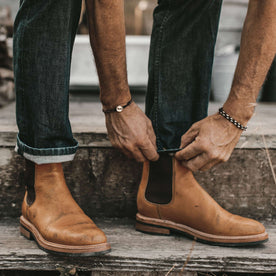 The fit model cuffing his jeans