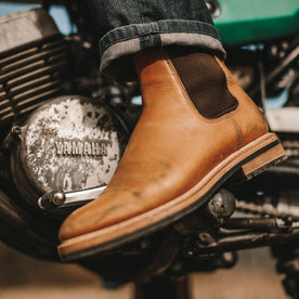 Fit model showing the detail shot of the Ranch boots