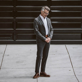 Our fit model wearing the Telegraph Suit in Charcoal Herringbone