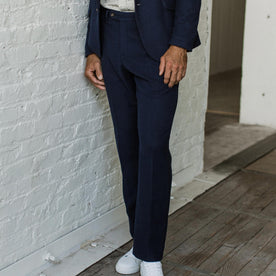 Our fit model wearing The Telegraph Trouser in Navy Boiled Wool by Taylor Stitch.