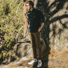 fit model next to a bouldering spot