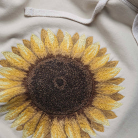 material shot close up of the embroidery of The Fillmore Hoodie in Sunflower Embroidery