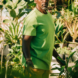 fit model showing profile of The Heavy Bag Tee in Chlorophyll