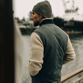fit model showing back of The Anchorage Vest in Charcoal Dry Wax