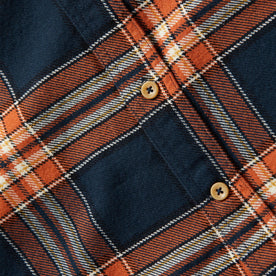 material shot of The Ledge Shirt in Rust Plaid's front placket