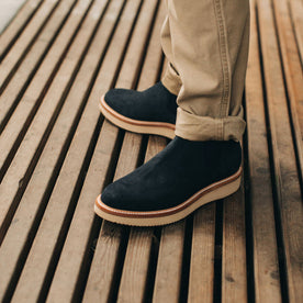 our fit model wearing The Ranch Low in Weatherproof Navy Suede—on a deck