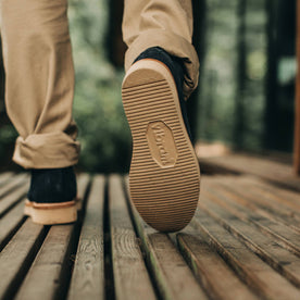 our fit model wearing The Ranch Low in Weatherproof Navy Suede—walking away