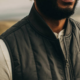 fit model wearing The Able Vest in Quilted Charcoal, chest detail
