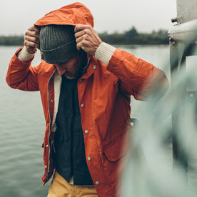 fit model putting on hood of The Dalton Jacket in Rust