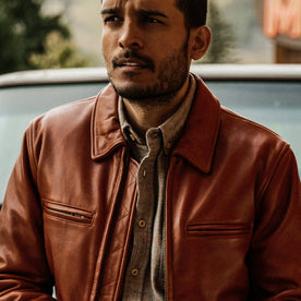 fit model wearing The Moto Jacket in Whiskey Steerhide, looking left