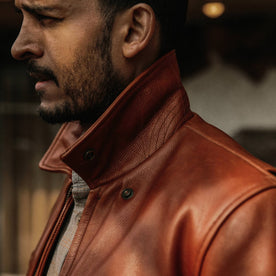 fit model wearing The Moto Jacket in Whiskey Steerhide, collar popped