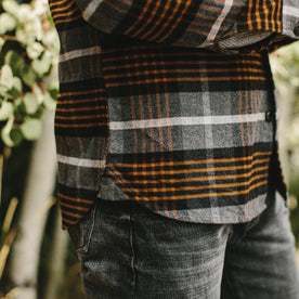 fit model wearing The Moto Shirt in Orange Plaid, side detail