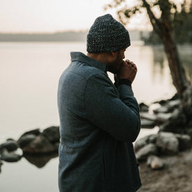 fit model wearing The Lined Utility Shirt in Indigo and Slate Twill warming his hands