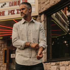 fit model wearing The Utility Shirt in Japanese Kuroki Natural Nep cuffing his sleeve