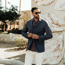 our fit model wearing The Gibson Jacket in Navy—looking right