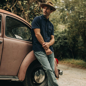 our fit model wearing The Caravan Shirt in Navy Seersucker—looking left