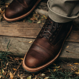 our fit model wearing The Moto Boot in Chocolate Pebble Grain—top of boot