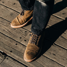 our fit model wearing The Moto Boot in Golden Brown Waxed Suede