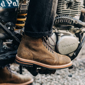 our fit model wearing The Moto Boot in Golden Brown Waxed Suede
