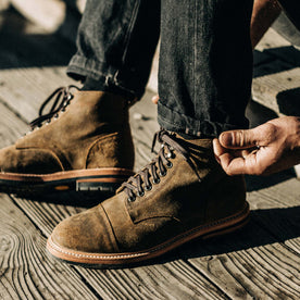 our fit model wearing The Moto Boot in Golden Brown Waxed Suede
