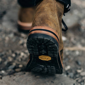 our fit model wearing The Moto Boot in Golden Brown Waxed Suede