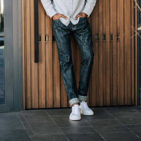 our fit model wearing the slim jean in Green Cast Selvage