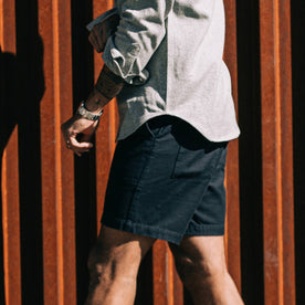 our fit model wearing The Trail Short in Navy Slub Sateen—walking left