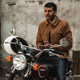 fit model wearing The Wyatt Jacket in Cognac Suede, on motorcycle