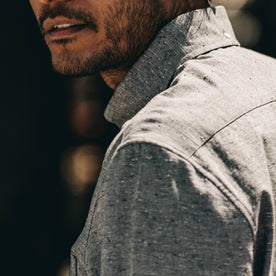 our fit model wearing The Jack in Charcoal Fleck—cropped shot of shoulder