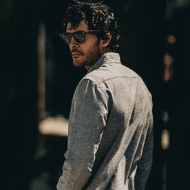 our fit model wearing The Jack in Charcoal Fleck—cropped shot of shoulder and back. Model looking left of screen