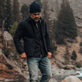 out fit model wearing The Wilton Jacket in Navy Birdseye Wool—walking near creek