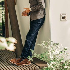 our fit model wearing The Camp Pant in Indigo Corduroy against a wall