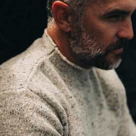 our fit model wearing The Seafarer Sweater in Natural Donegal—cropped shot looking left