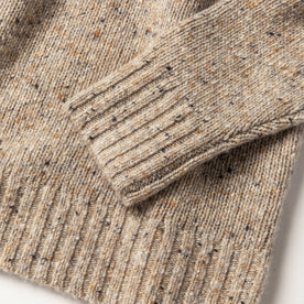 material shot of wrist and bottom stitch detailing