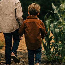 our fit model wearing The Little Yosemite Shirt in Tobacco—walking with his brother
