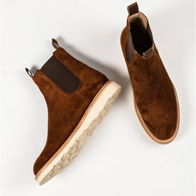 two boots in studio shot—one laying on its side
