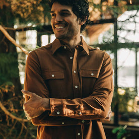 our fit model wearing The Yosemite Shirt in Tobacco—smiling, looking left