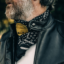 our fit model wearing The Band Collar Moto Jacket—looking left, band collar shot
