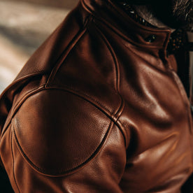 our fit model wearing The Band Collar Moto Jacket—shoulder detail