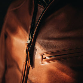 our fit model wearing The Band Collar Moto Jacket—chest zipper shot