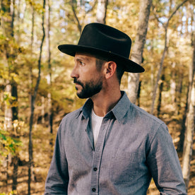 fit model wearing The Packable Lane Splitter in Espresso, looking left