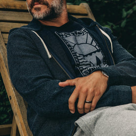 our fit model rocking The Après Hoodie in Indigo Waffle—cropped shot of chest sitting down